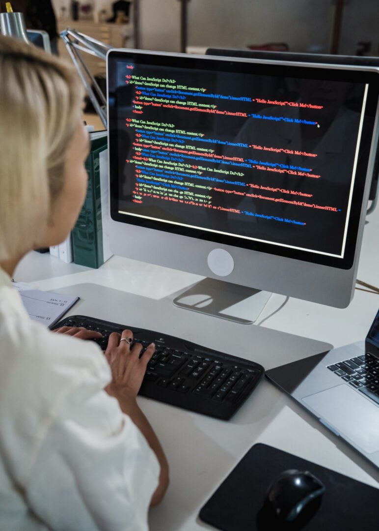 A woman working on the code